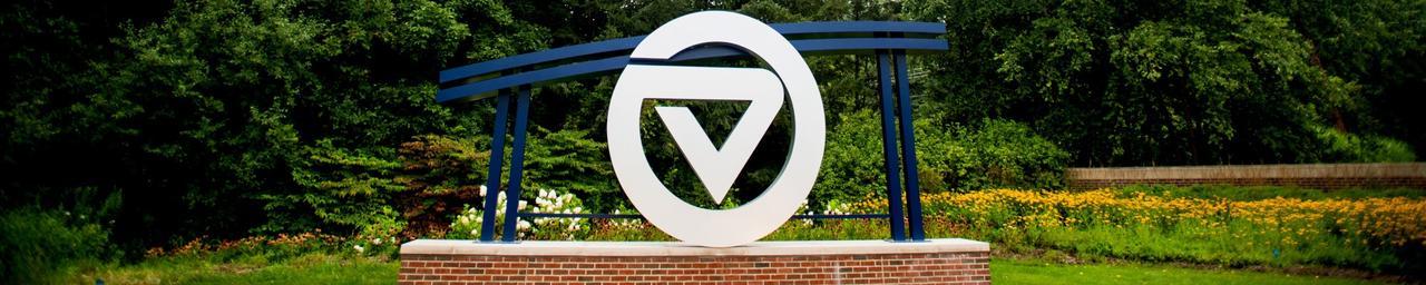 GV circle logo signage located in front of University entrance